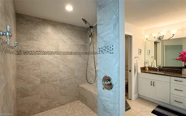a bathroom with a shower and a sink