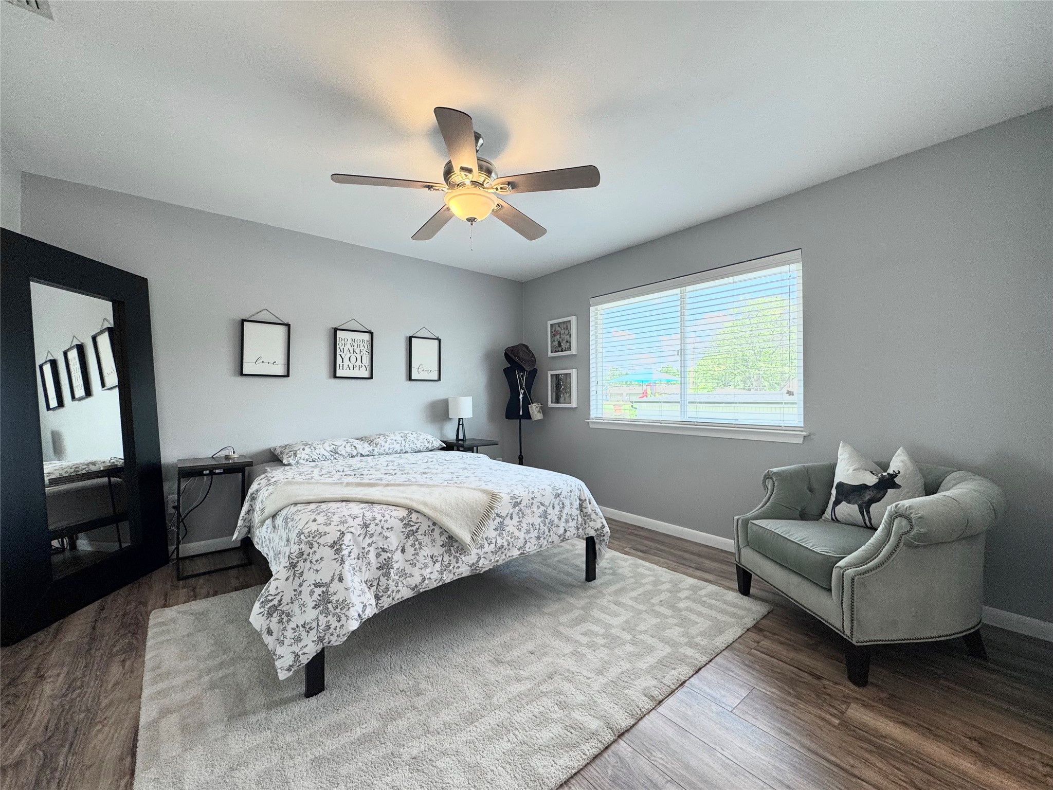 208 Skyloop Drive Austin, TX 78745 - Photo 18 of 33 Upstairs Bedroom Suite featuring a big window for lots of natural light and an attached bathroom with two separate vanities