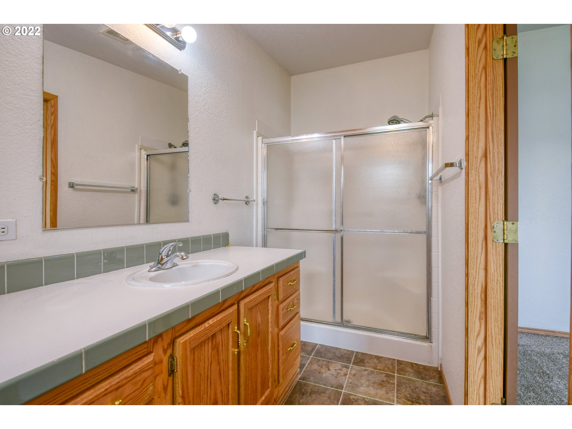2600 Southwest Goodwin Avenue, Unit 33 Pendleton, OR 97801 - Photo 18 of 29 a bathroom with a sink and a mirror