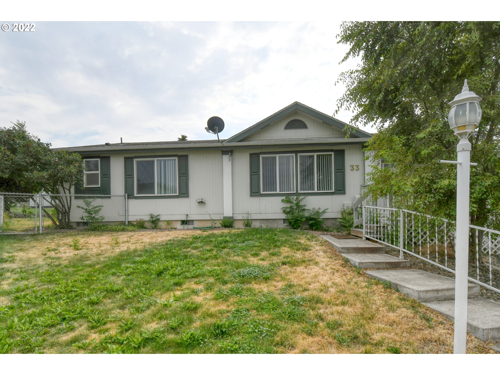 2600 Southwest Goodwin Avenue, Unit 33 Pendleton, OR 97801 - Photo 4 of 29 a front view of a house with garden