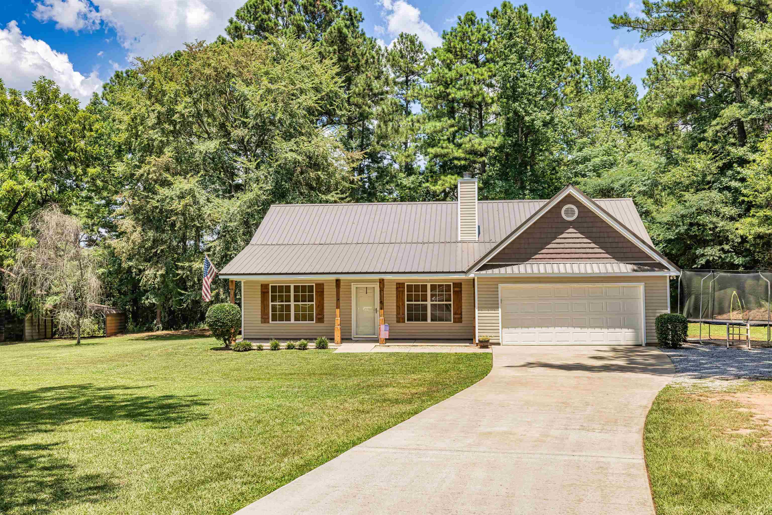 1596 Flat Shoals Road Concord, GA 30206 - Photo 1 of 1 a front view of a house with a yard
