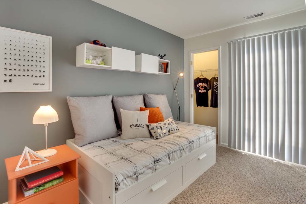 170 MacArthur Drive, Unit 5922 Willowbrook, IL 60527 - Photo 16 of 29 a bed room with a bed and a lamp