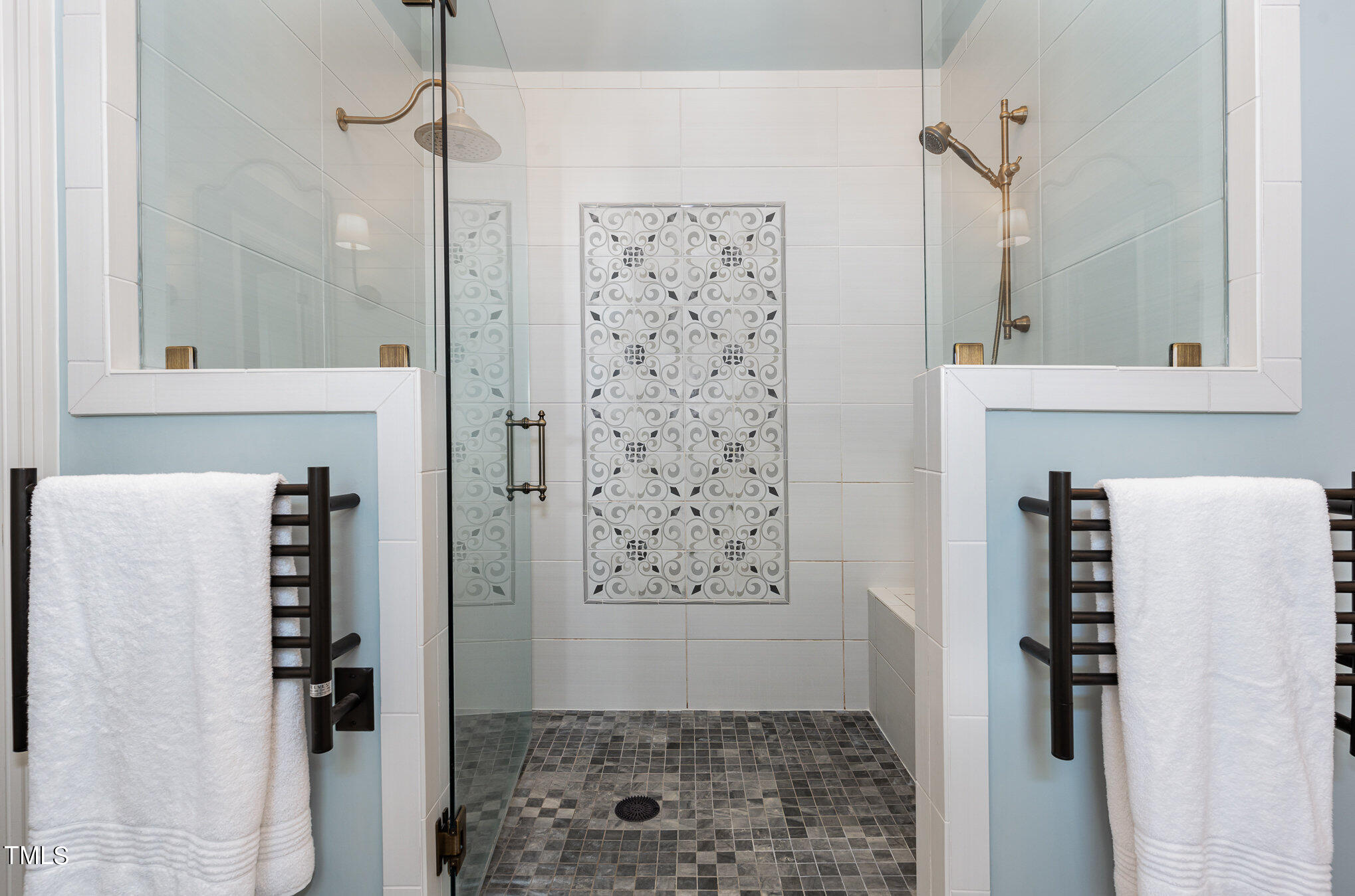 1505 Sweetwater Lane Raleigh, NC 27610 - Photo 26 of 54 Amazing Oversized, Walk In Shower w/Decorative Tile Insert, Dual Shower Heads and Seating.Towel Warmers Complete this Spa Like Space