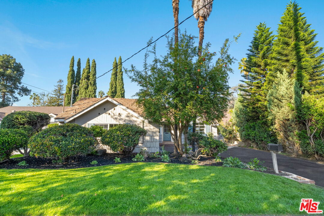 15115 Gilmore Street Van Nuys, CA 91411 - Photo 2 of 26 a view of a house with a yard