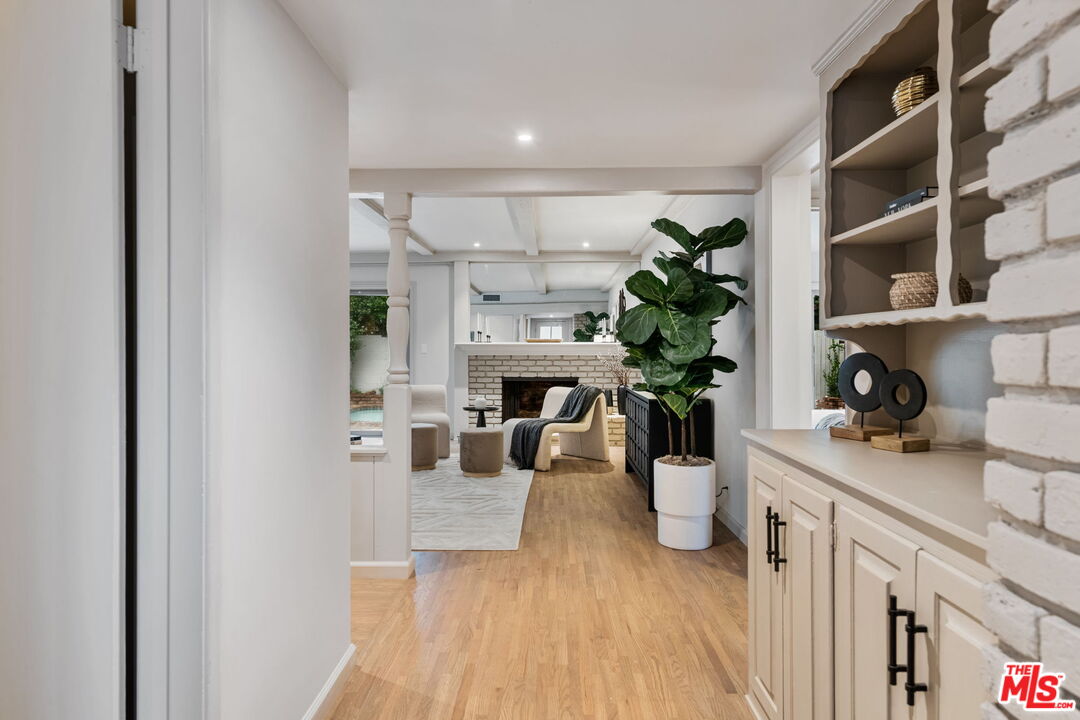 15115 Gilmore Street Van Nuys, CA 91411 - Photo 3 of 26 a view of a living room and dining room