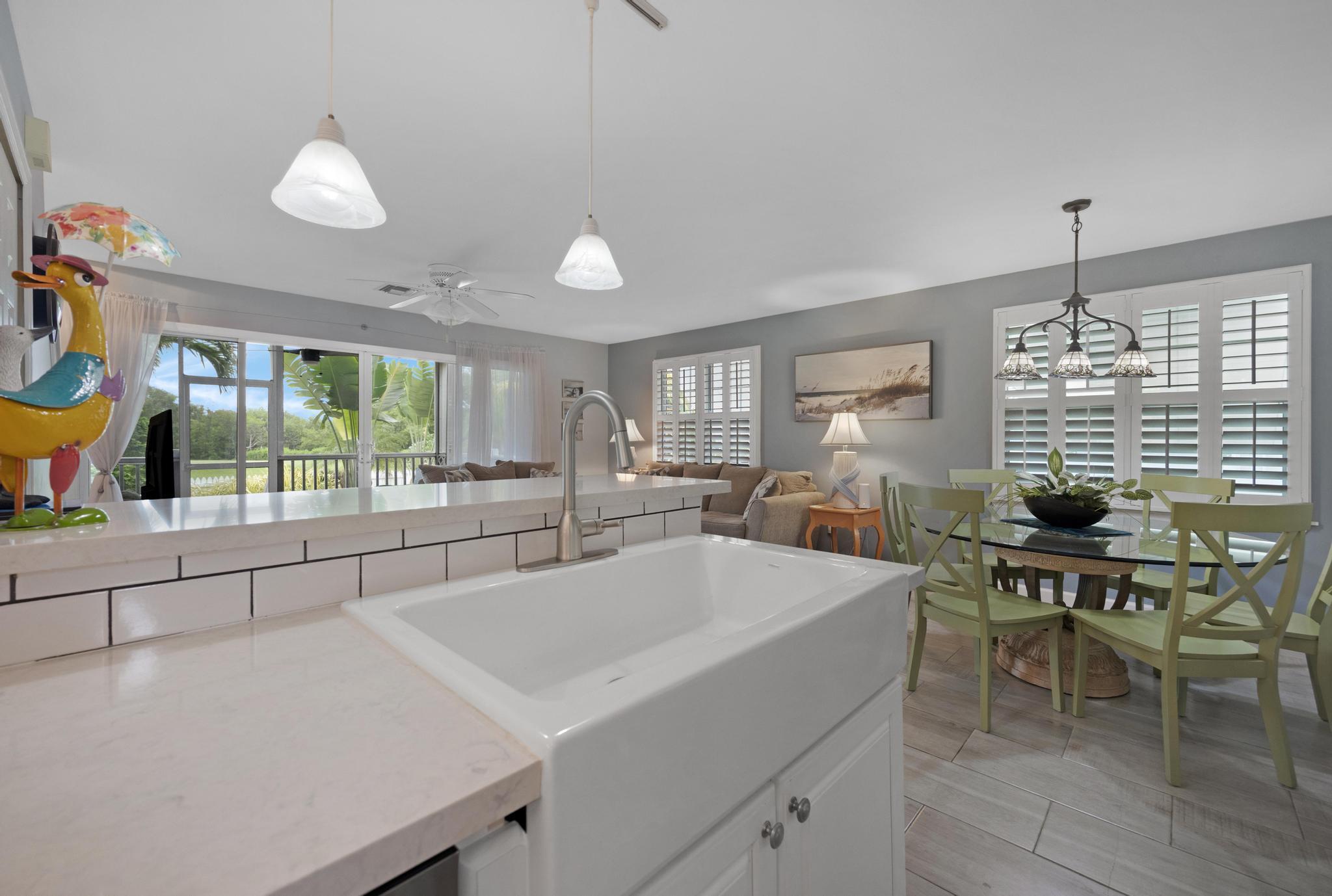 30 Whistling Duck Lane Key West, FL 33040 - Photo 13 of 38 a large white kitchen with a large window