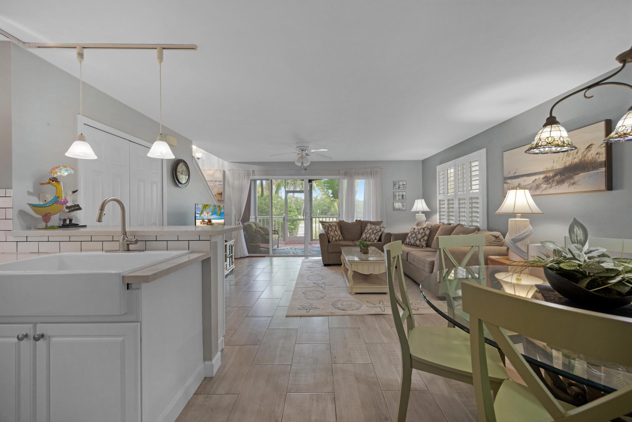 30 Whistling Duck Lane Key West, FL 33040 - Photo 14 of 38 a living room with lots of furniture and a chandelier