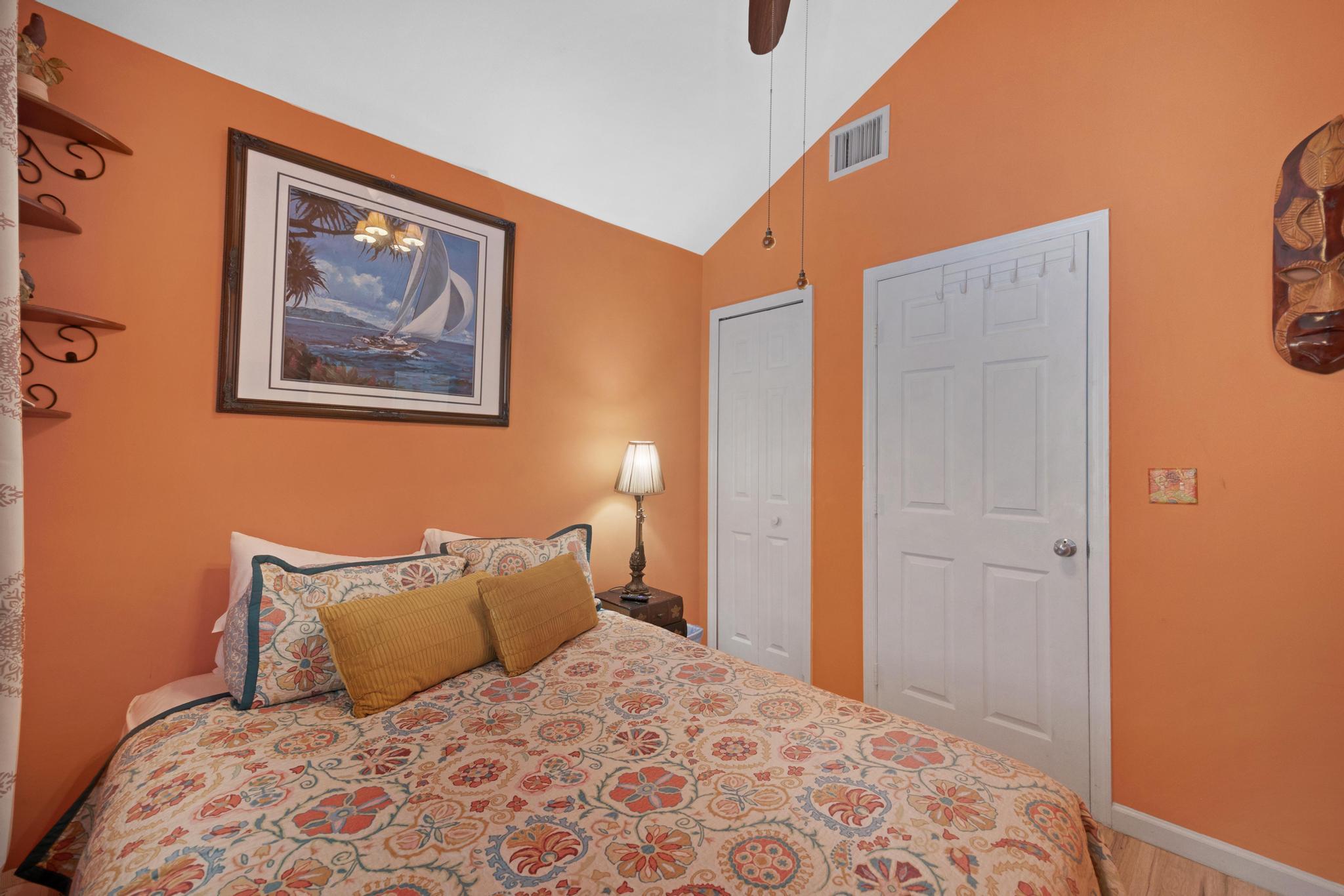 30 Whistling Duck Lane Key West, FL 33040 - Photo 17 of 38 a bedroom with a bed and a painting on the wall