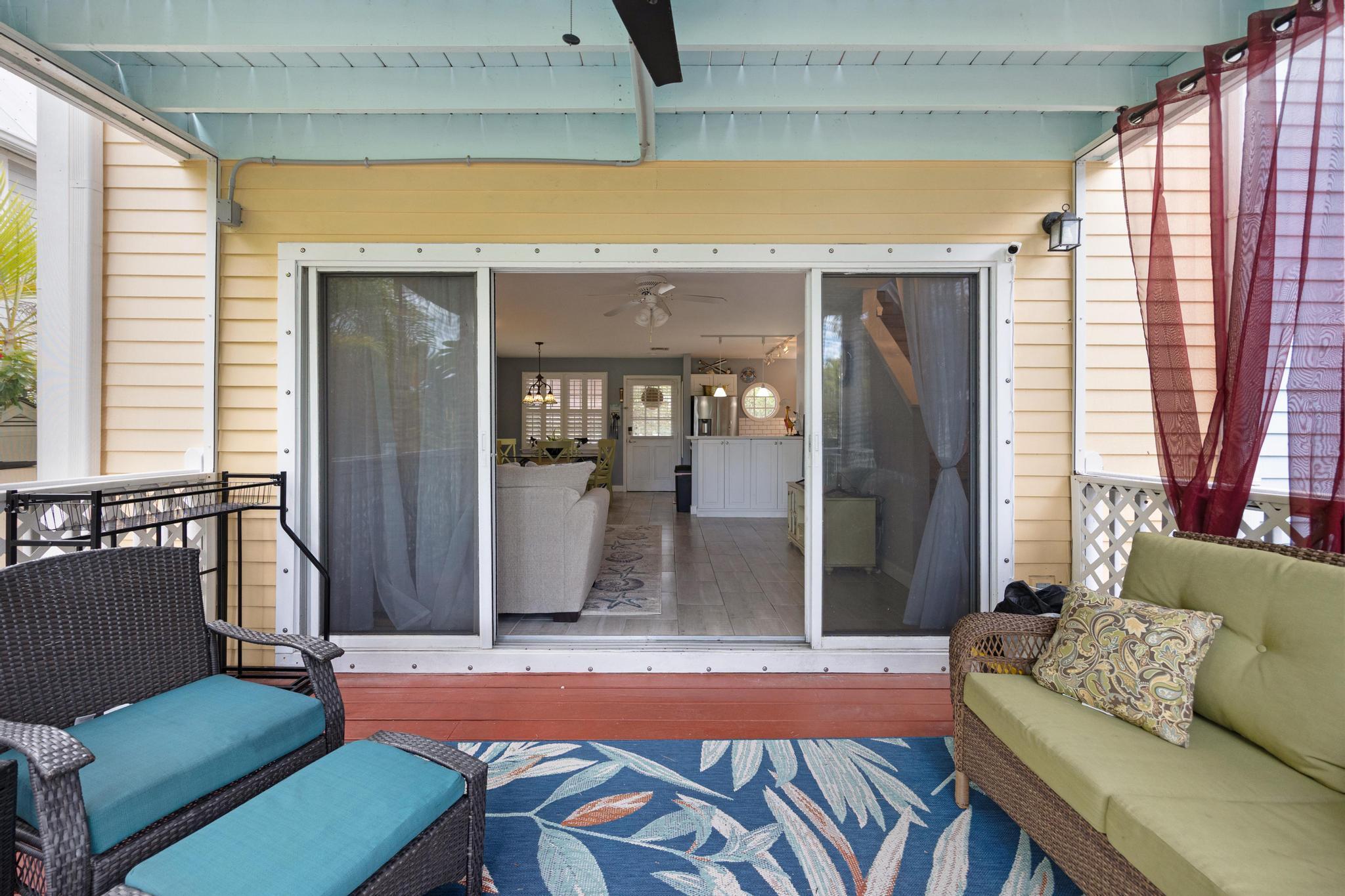 30 Whistling Duck Lane Key West, FL 33040 - Photo 18 of 38 a living room with furniture and a large window