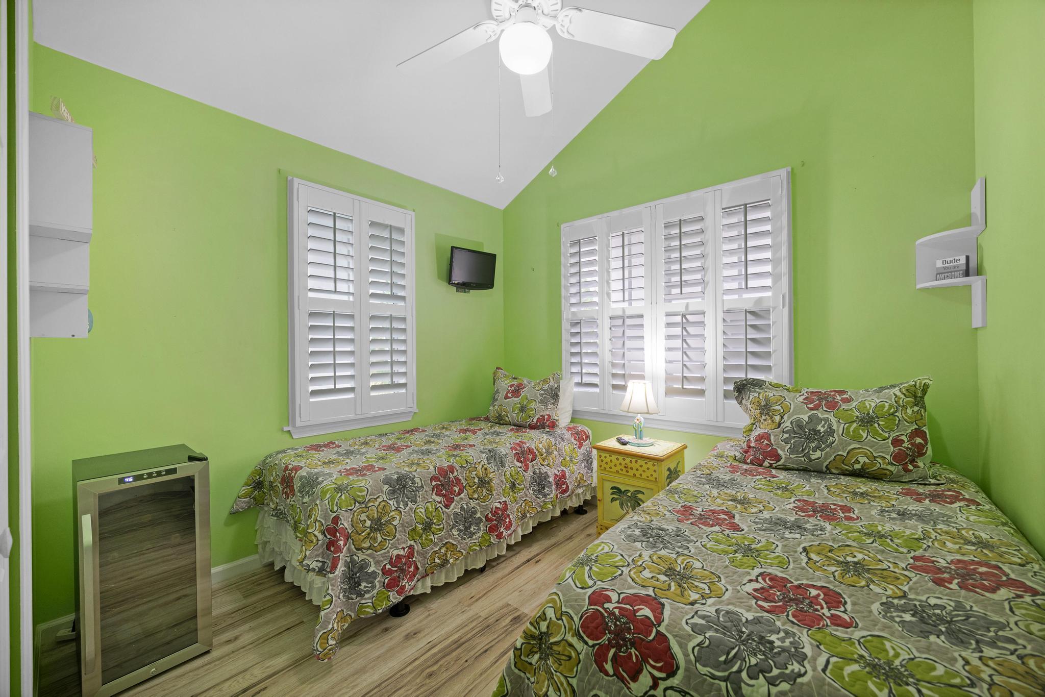 30 Whistling Duck Lane Key West, FL 33040 - Photo 19 of 38 a bedroom with a bed and a chandelier