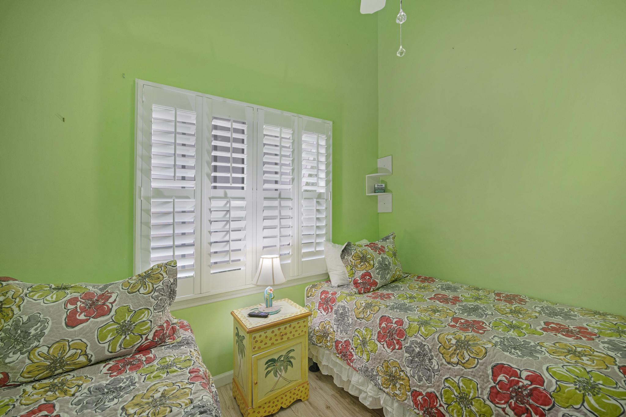 30 Whistling Duck Lane Key West, FL 33040 - Photo 20 of 38 a bedroom with a bed and a window