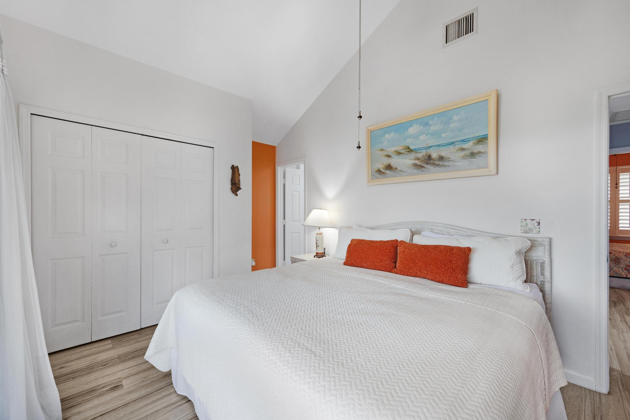 30 Whistling Duck Lane Key West, FL 33040 - Photo 23 of 38 a bedroom with a bed and wooden floor