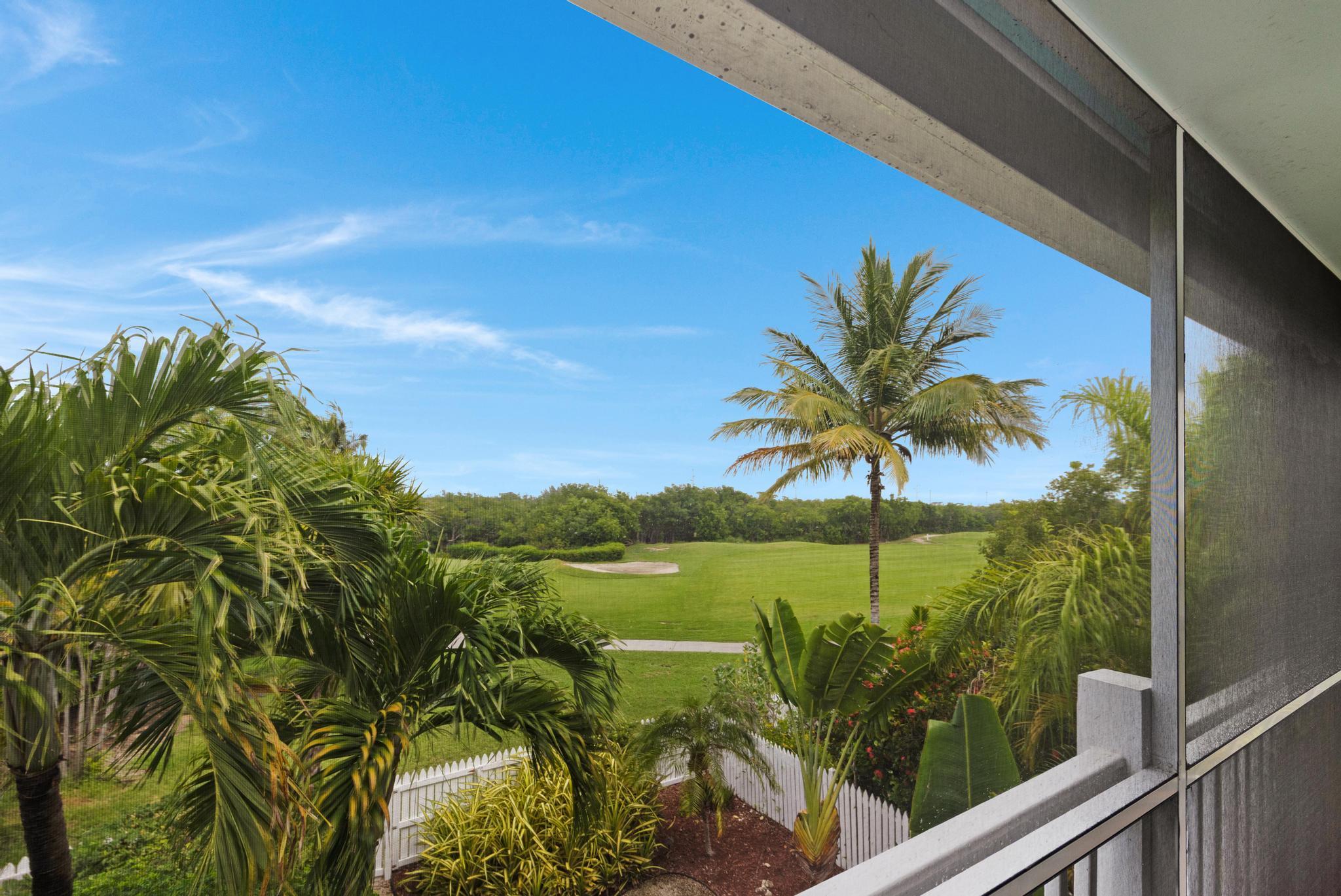 30 Whistling Duck Lane Key West, FL 33040 - Photo 26 of 38 a view of a palm plant from a balcony