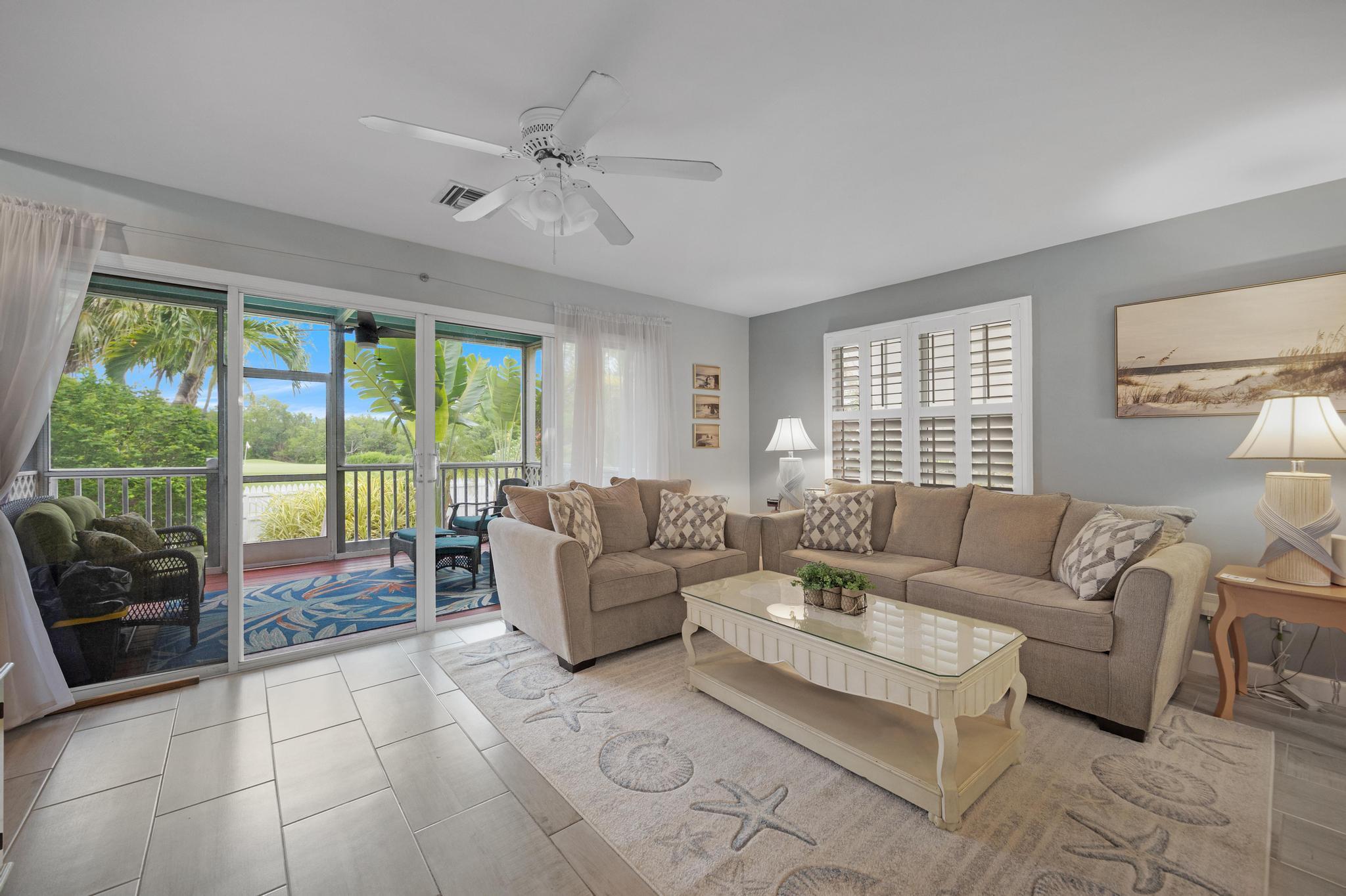 30 Whistling Duck Lane Key West, FL 33040 - Photo 9 of 38 a living room with furniture and a large window