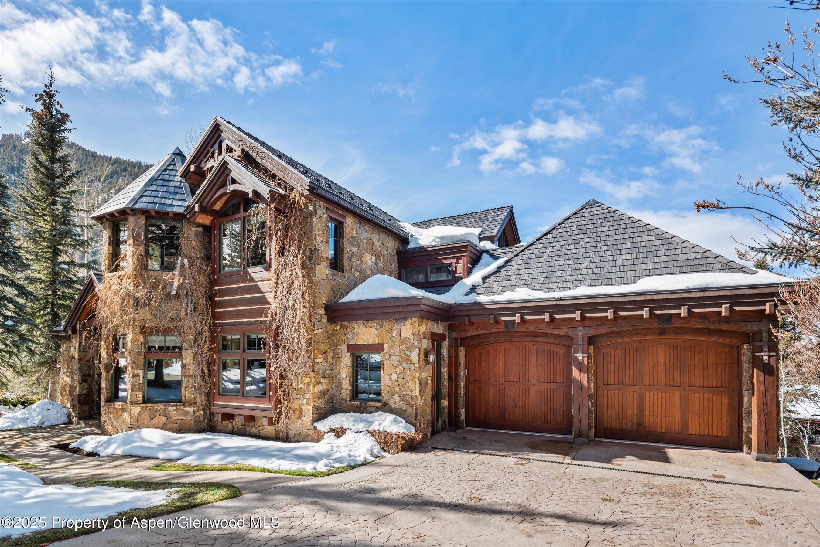 1225 Riverside Drive Aspen, CO 81611 - Photo 2 of 47 a front view of a house