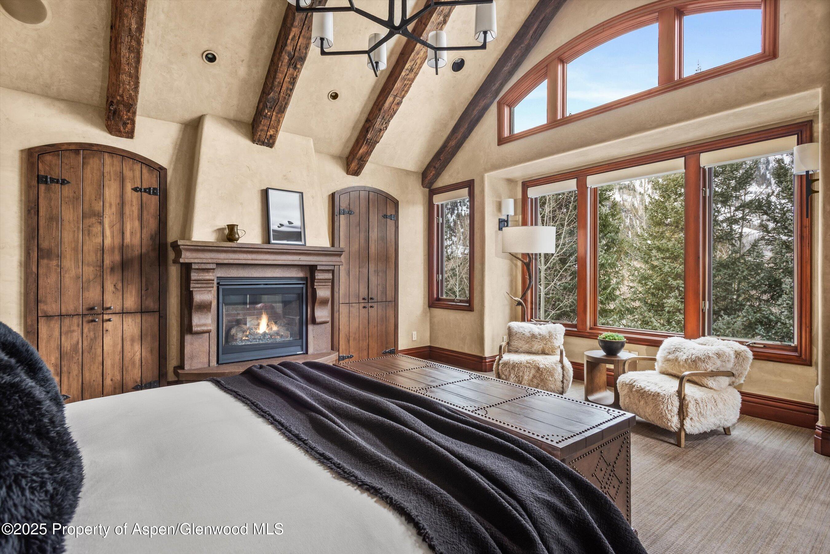 1225 Riverside Drive Aspen, CO 81611 - Photo 27 of 47 a living room with furniture fireplace and large windows