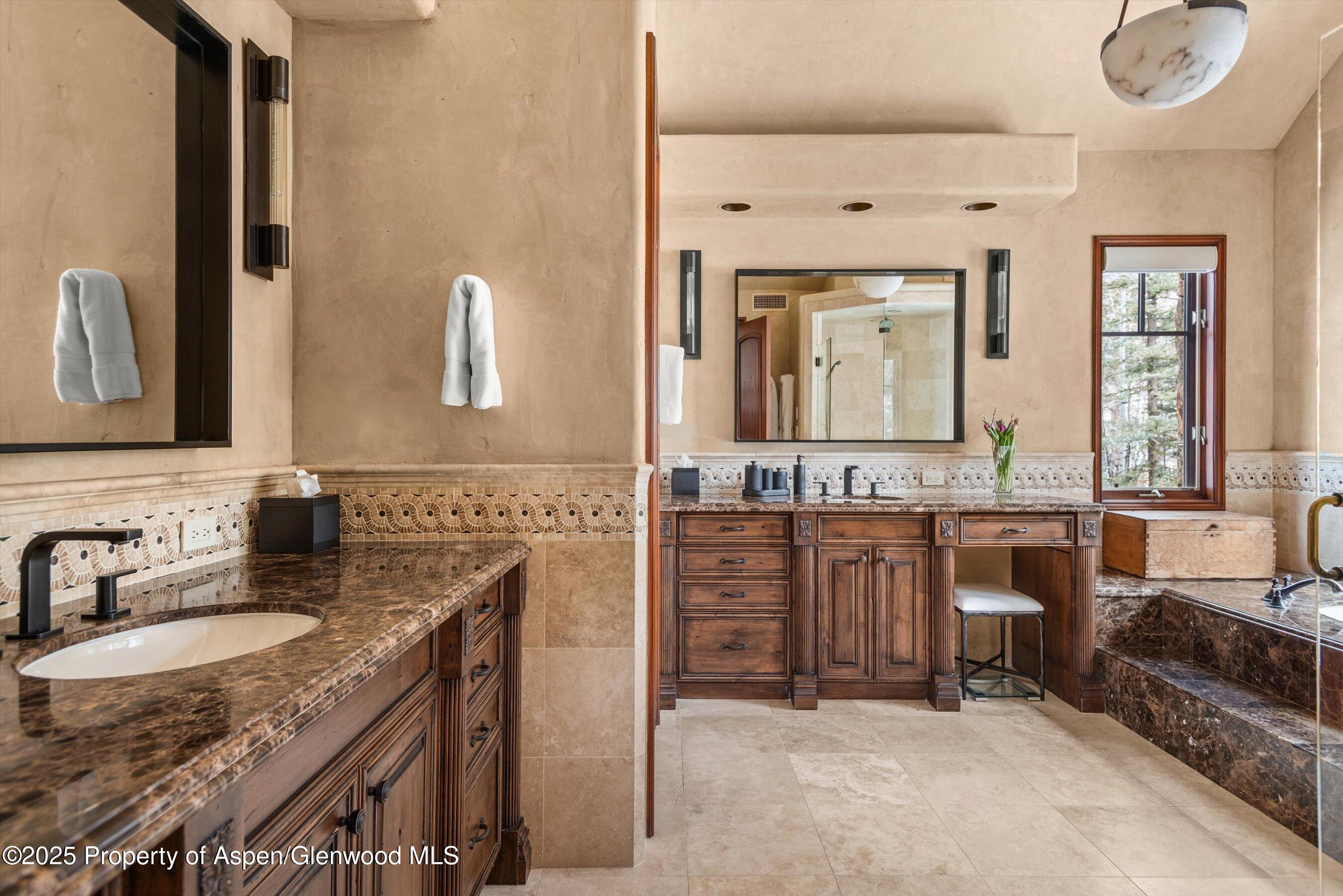 1225 Riverside Drive Aspen, CO 81611 - Photo 29 of 47 a spacious bathroom with a granite countertop double vanity sink a mirror and a