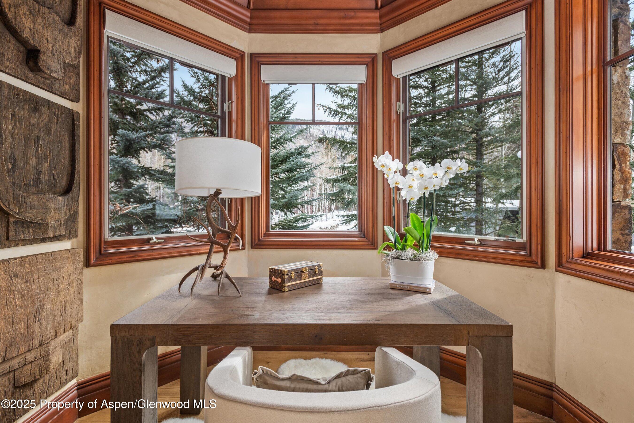 1225 Riverside Drive Aspen, CO 81611 - Photo 31 of 47 a dining room with a table and chairs