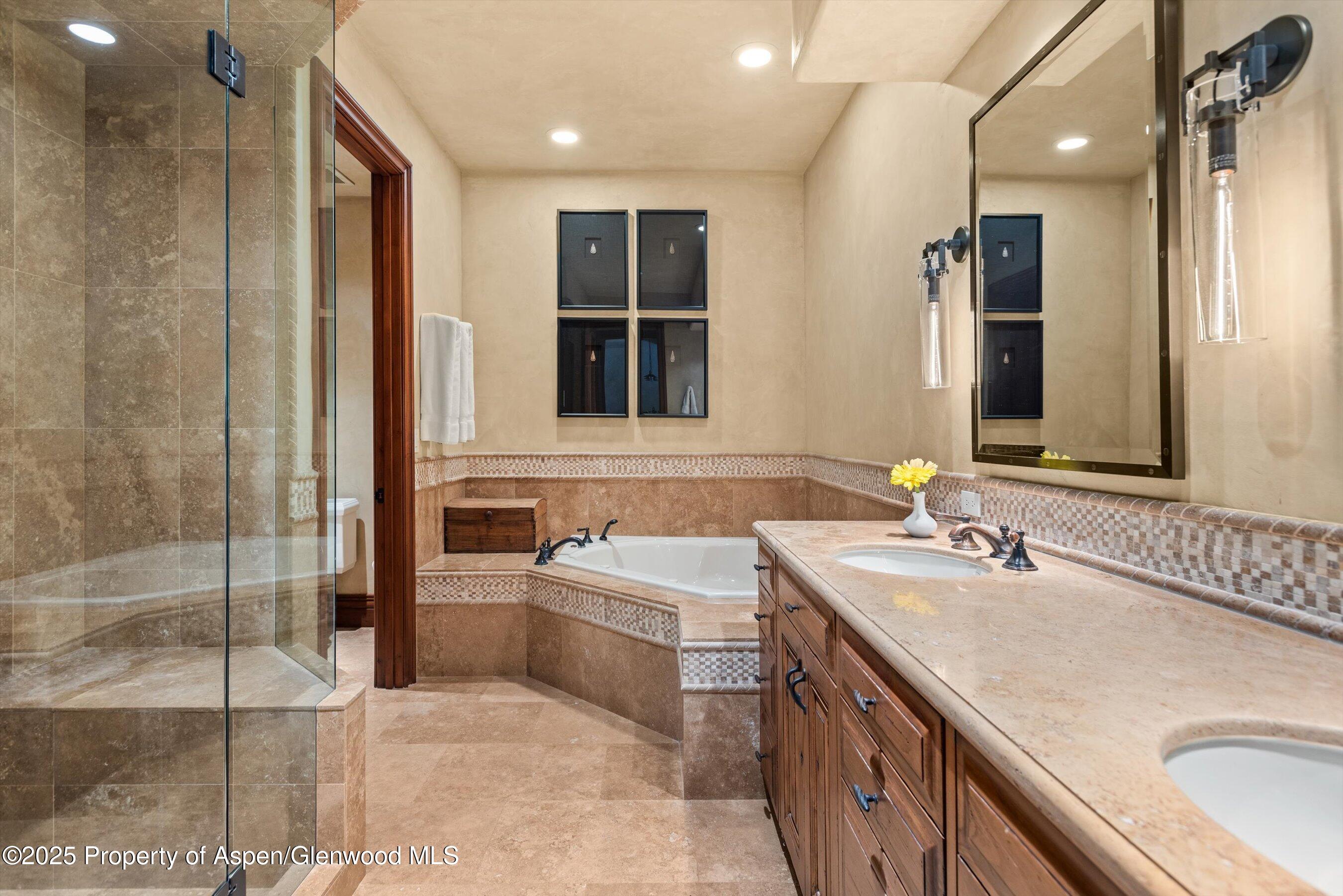 1225 Riverside Drive Aspen, CO 81611 - Photo 36 of 47 a bathroom with a sink double vanity and a shower