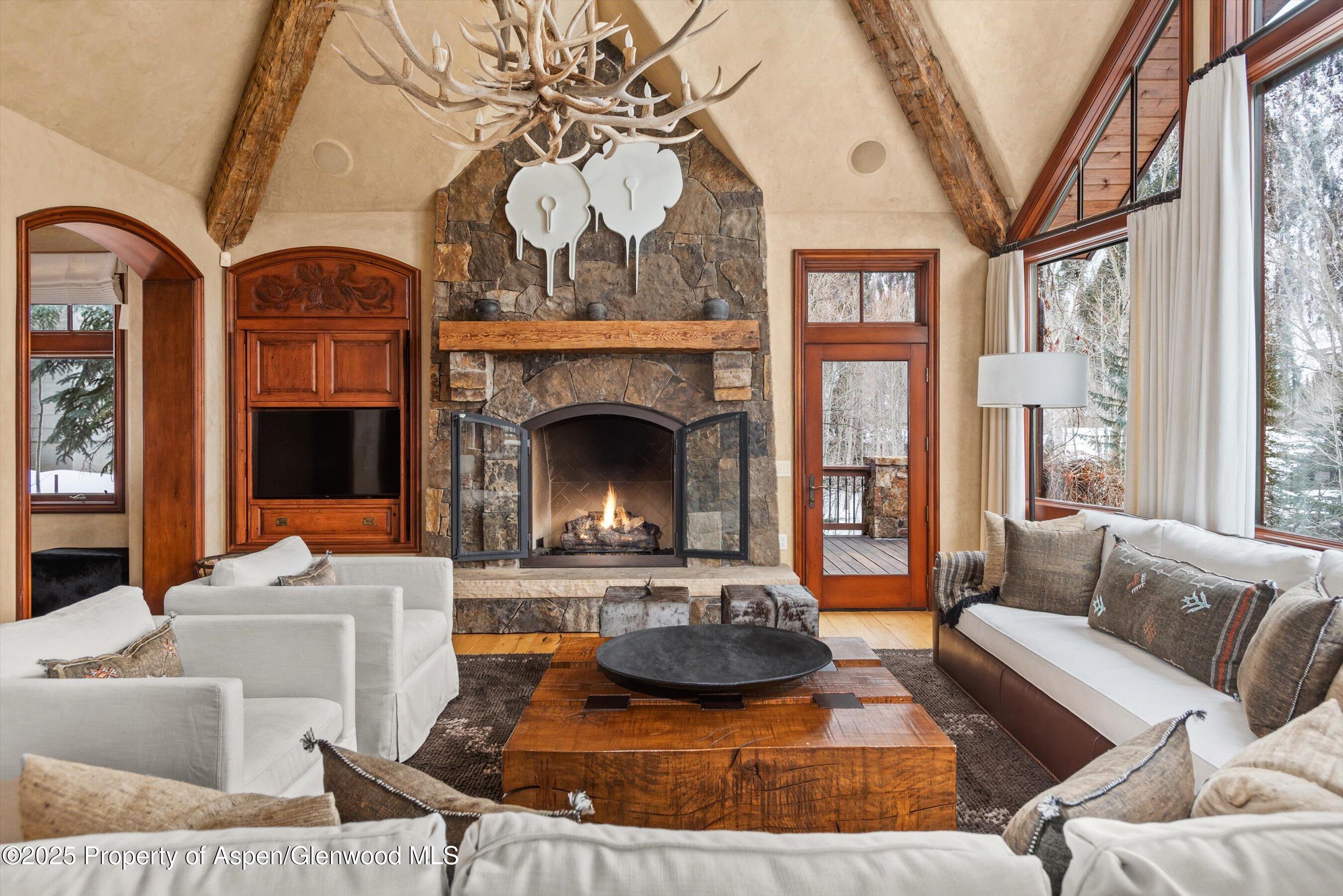 1225 Riverside Drive Aspen, CO 81611 - Photo 9 of 47 a living room with furniture and a fireplace