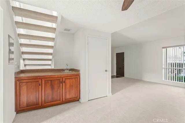 a view of a kitchen with microwave and a stove