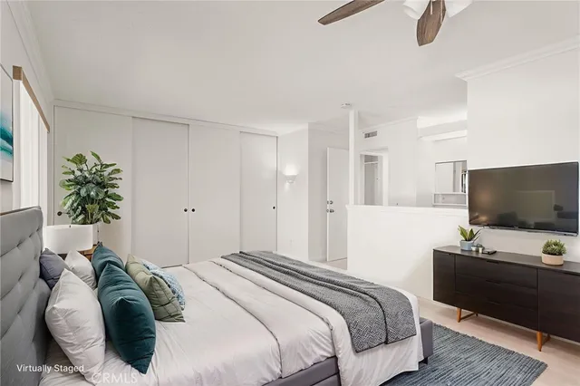 a view of an empty room with a ceiling fan