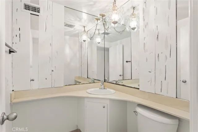 a patio with a table and chairs under an umbrella