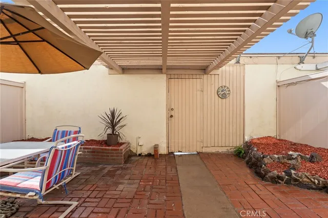 a view of a two chairs in the patio