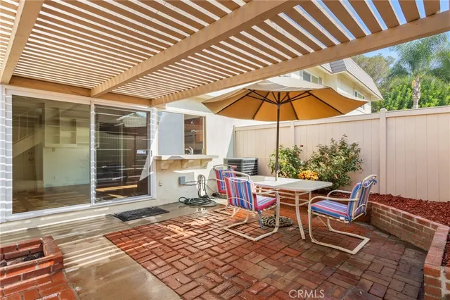 a view of front door with outdoor seating