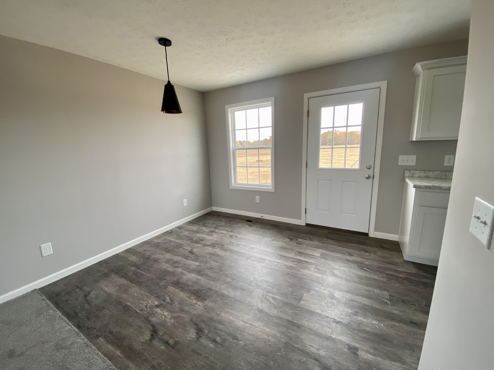104 Fleming Road Portland, TN 37148 - Photo 6 of 22 wooden floor in an empty room with a window