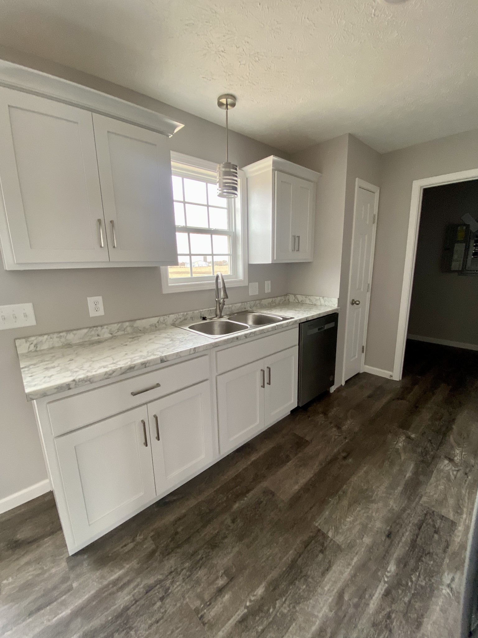 104 Fleming Road Portland, TN 37148 - Photo 7 of 22 a kitchen with a sink cabinets and window