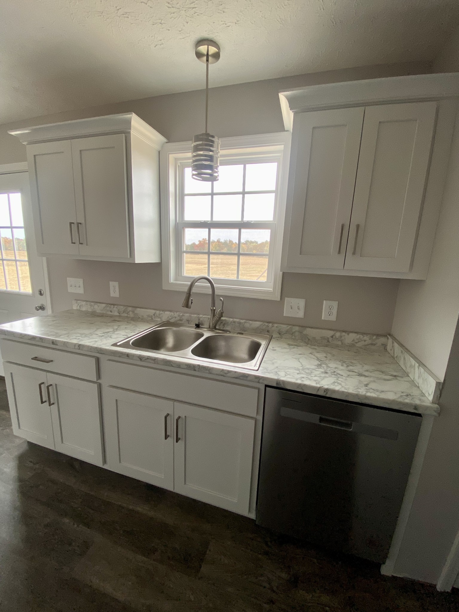 104 Fleming Road Portland, TN 37148 - Photo 10 of 22 a kitchen with sink cabinets and window