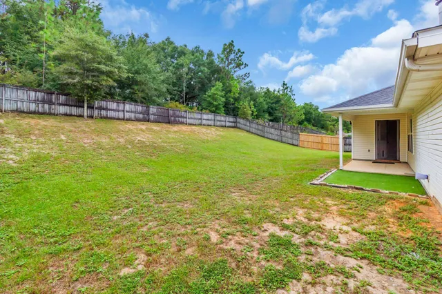a view of a swimming pool with an outdoor space and seating area