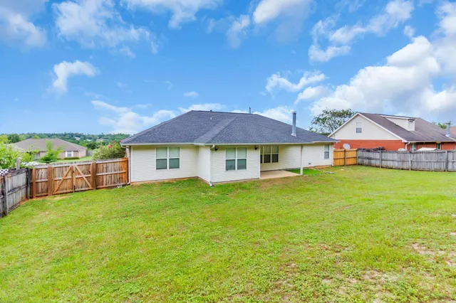 a view of a house with a big yard