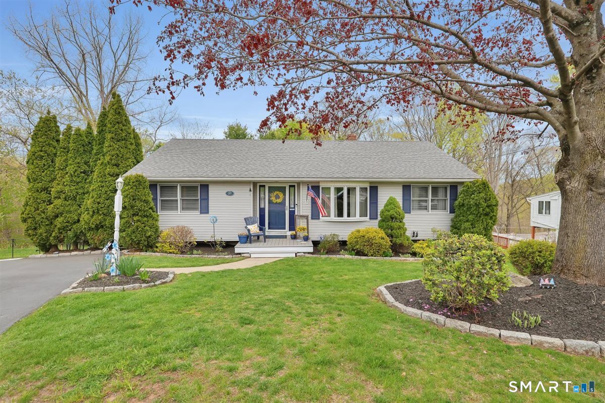 197 Dana Lane Meriden, CT 06451 - Photo 1 of 35 a front view of a house with a yard table and chairs