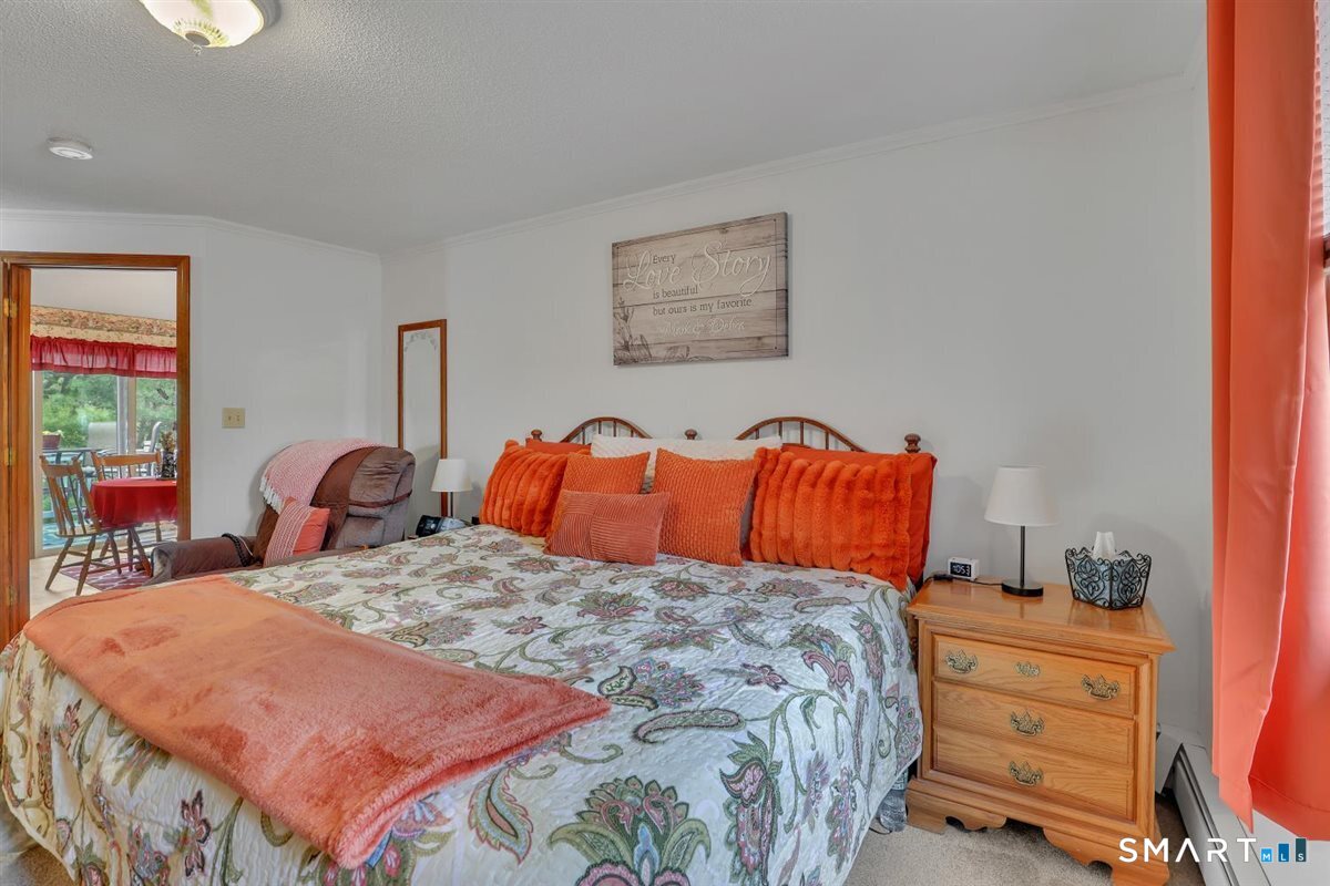 197 Dana Lane Meriden, CT 06451 - Photo 13 of 35 a bedroom with a bed and wooden floor