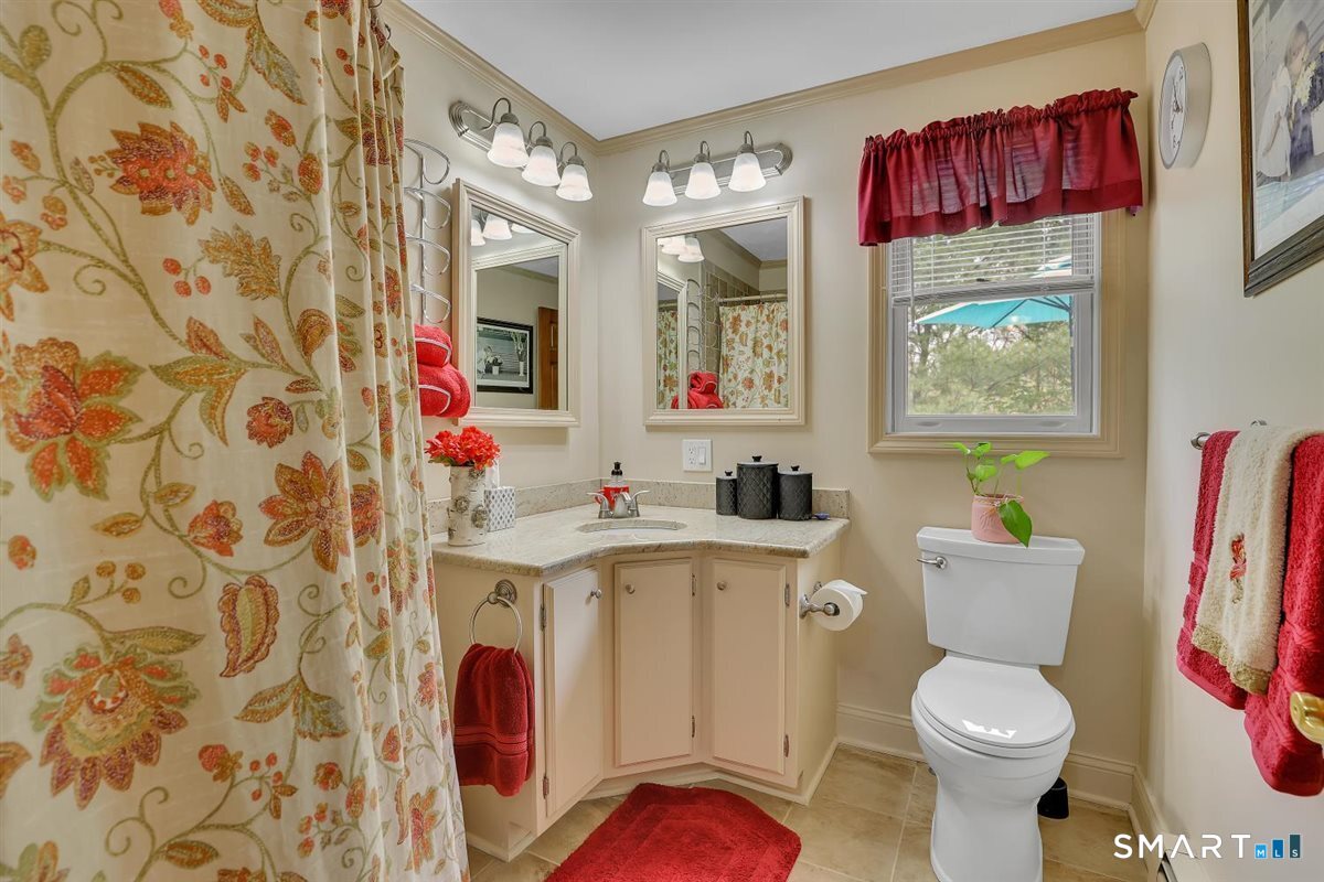 197 Dana Lane Meriden, CT 06451 - Photo 15 of 35 a bathroom with a sink toilet and a mirror