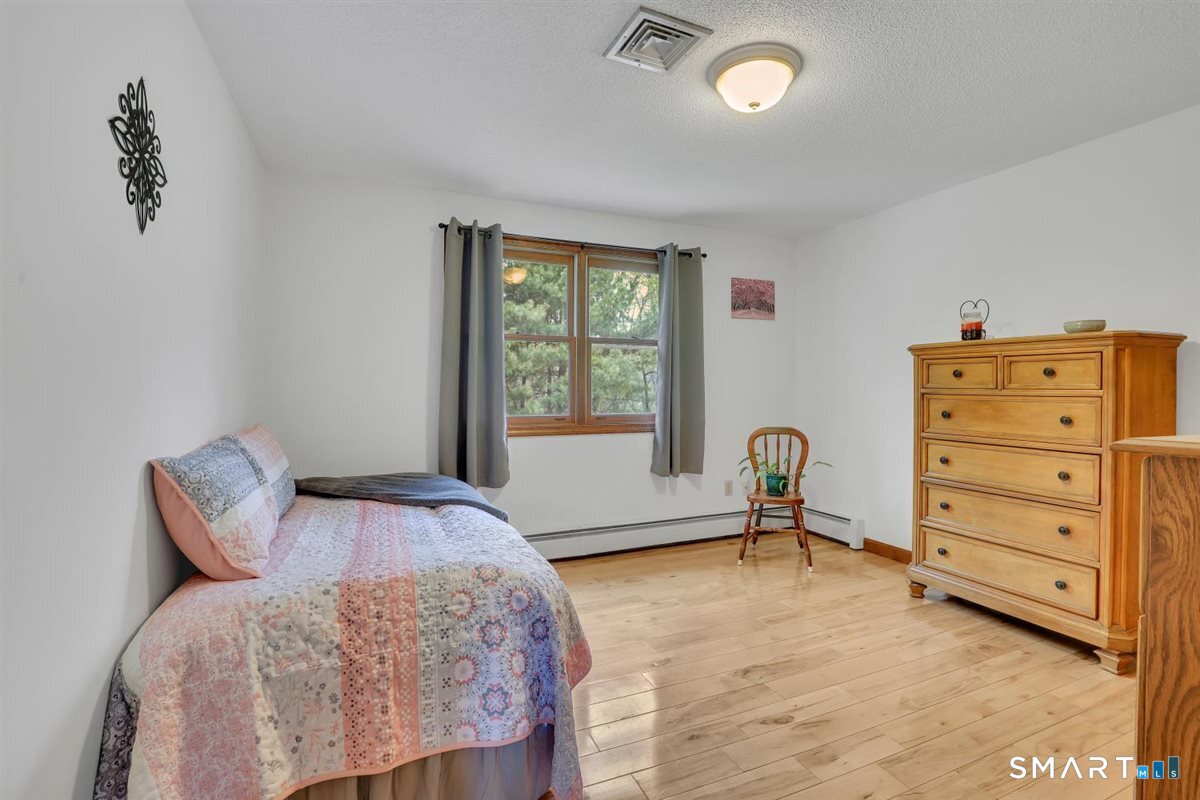 197 Dana Lane Meriden, CT 06451 - Photo 17 of 35 a bedroom with a bed and a window