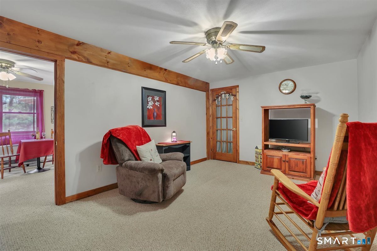 197 Dana Lane Meriden, CT 06451 - Photo 22 of 35 a living room with furniture and a flat screen tv