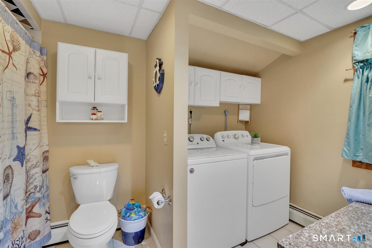 197 Dana Lane Meriden, CT 06451 - Photo 25 of 35 a bathroom with a toilet sink and mirror