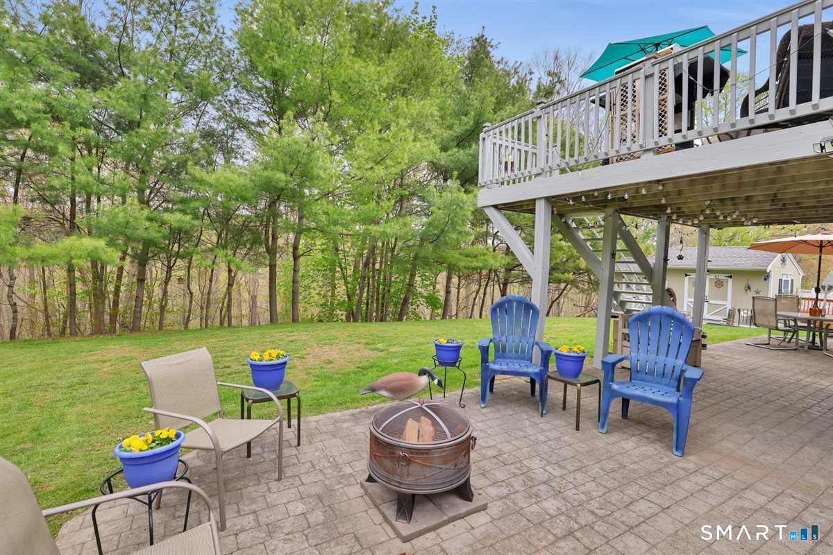 197 Dana Lane Meriden, CT 06451 - Photo 29 of 35 a view of a chairs and table in backyard of the house