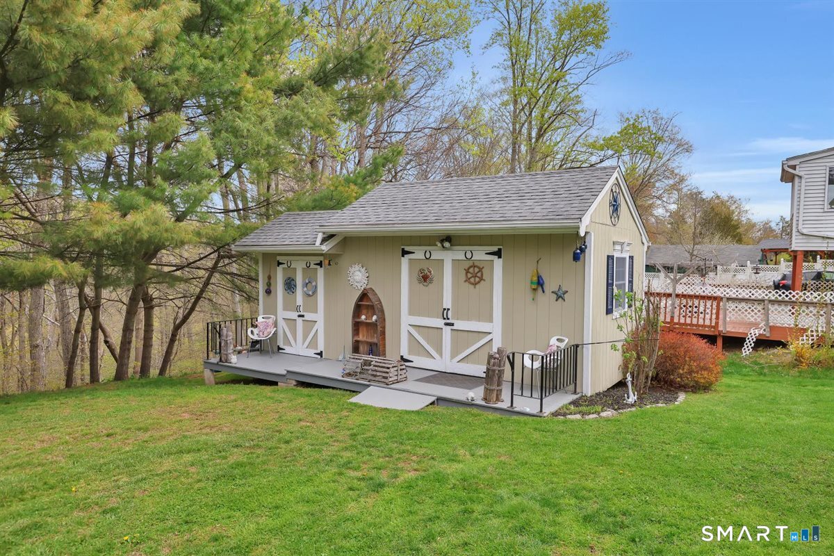 197 Dana Lane Meriden, CT 06451 - Photo 31 of 35 a view of a house with backyard porch and sitting area