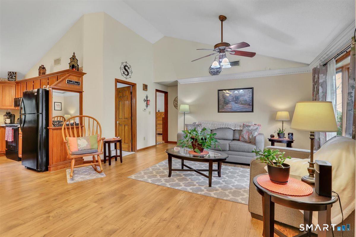 197 Dana Lane Meriden, CT 06451 - Photo 5 of 35 a living room with furniture and a chandelier