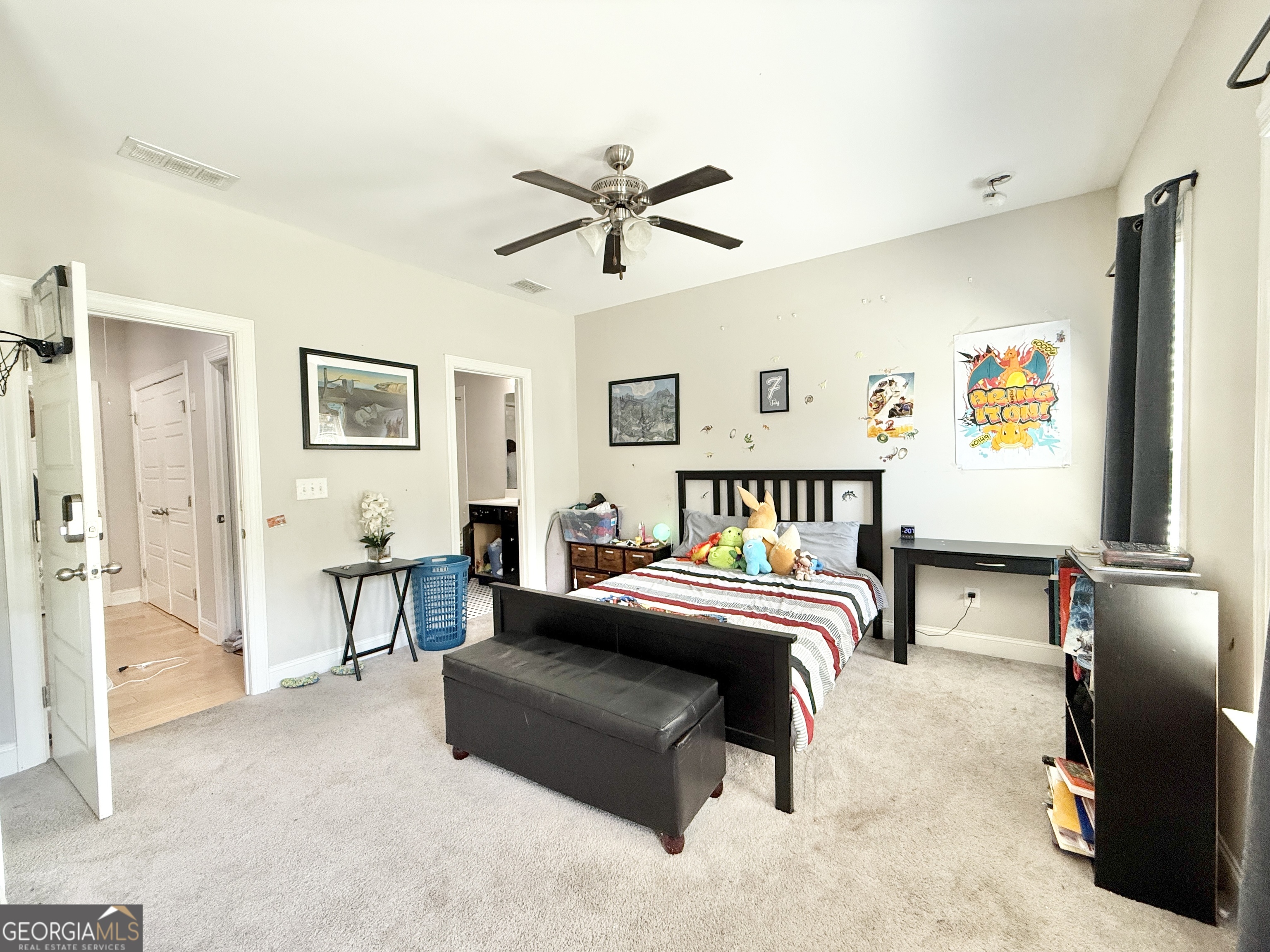 1817 Hislop Lane Atlanta, GA 30345 - Photo 14 of 32 a bedroom with a bed and a chandelier