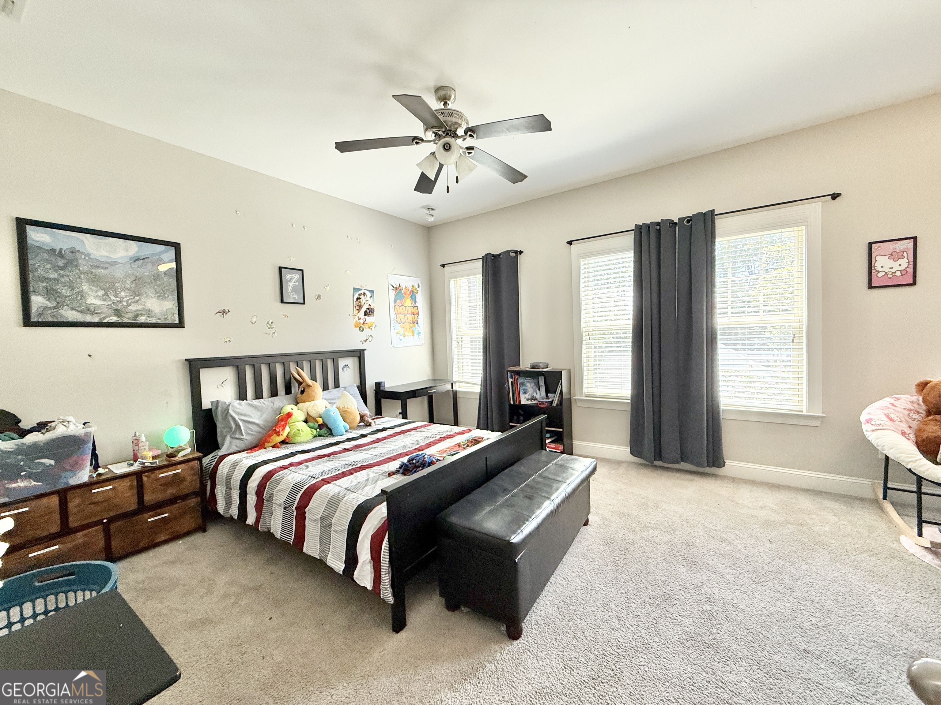1817 Hislop Lane Atlanta, GA 30345 - Photo 15 of 32 a bedroom with a bed and a chandelier
