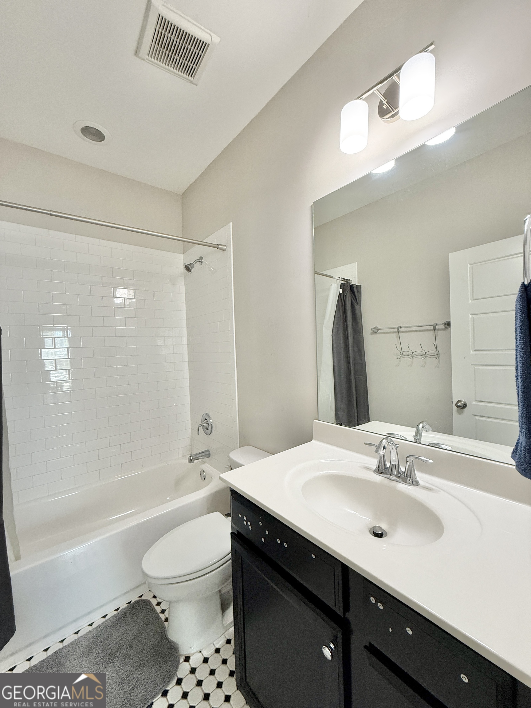 1817 Hislop Lane Atlanta, GA 30345 - Photo 16 of 32 a bathroom with a sink a toilet and shower