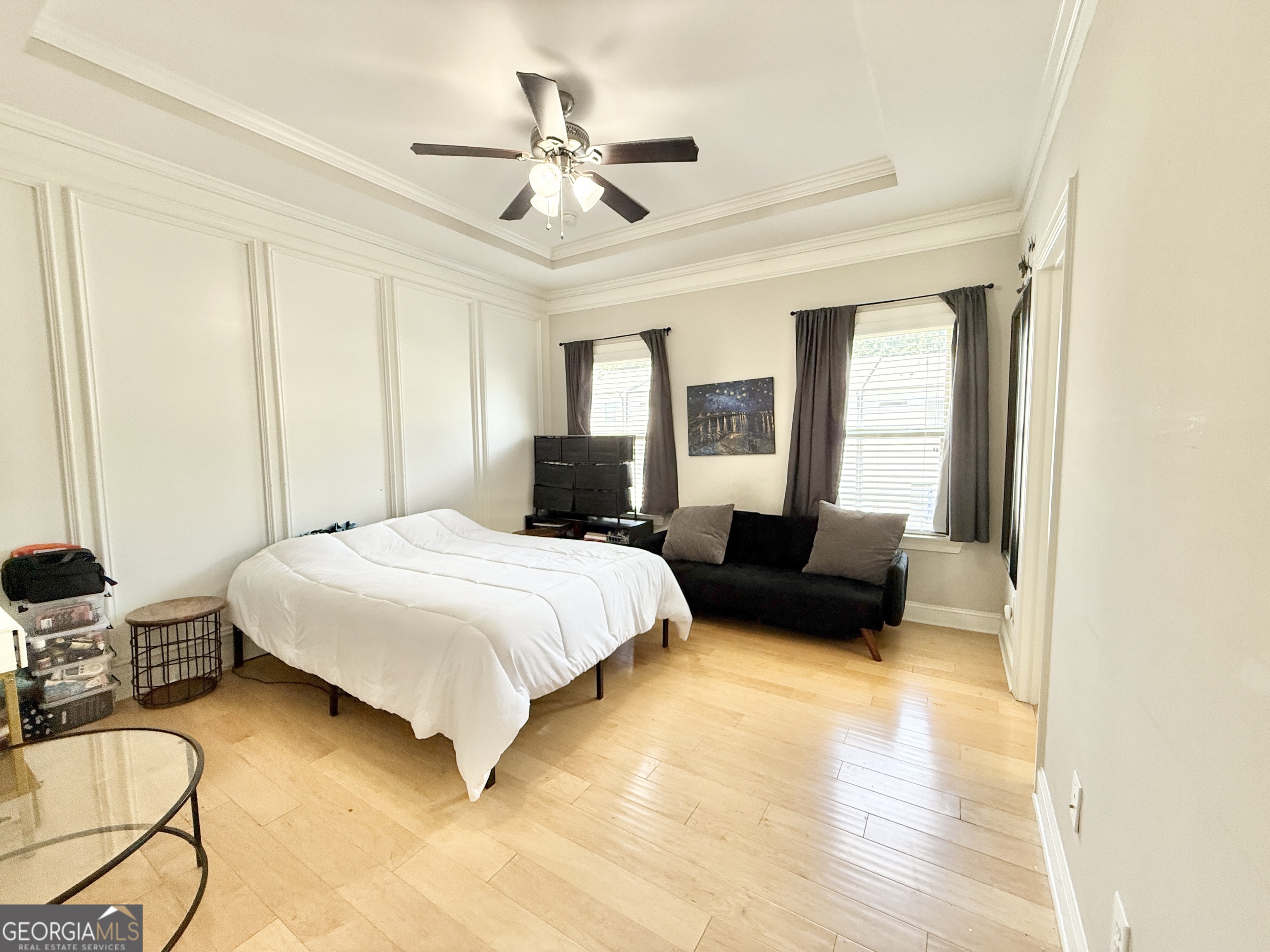 1817 Hislop Lane Atlanta, GA 30345 - Photo 17 of 32 a spacious bedroom with a bed a couch and a chandelier