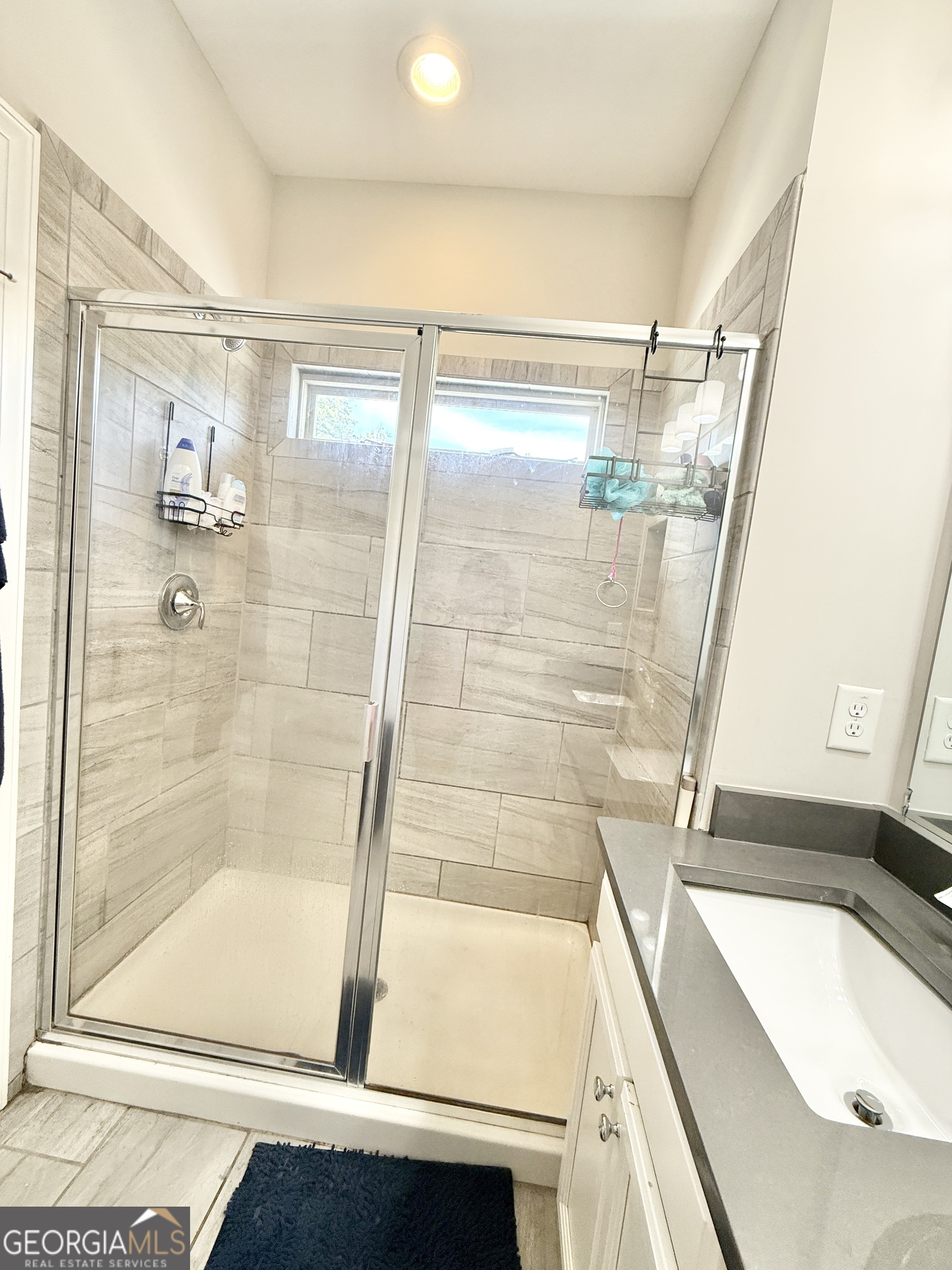1817 Hislop Lane Atlanta, GA 30345 - Photo 19 of 32 a bathroom with a tub and a shower