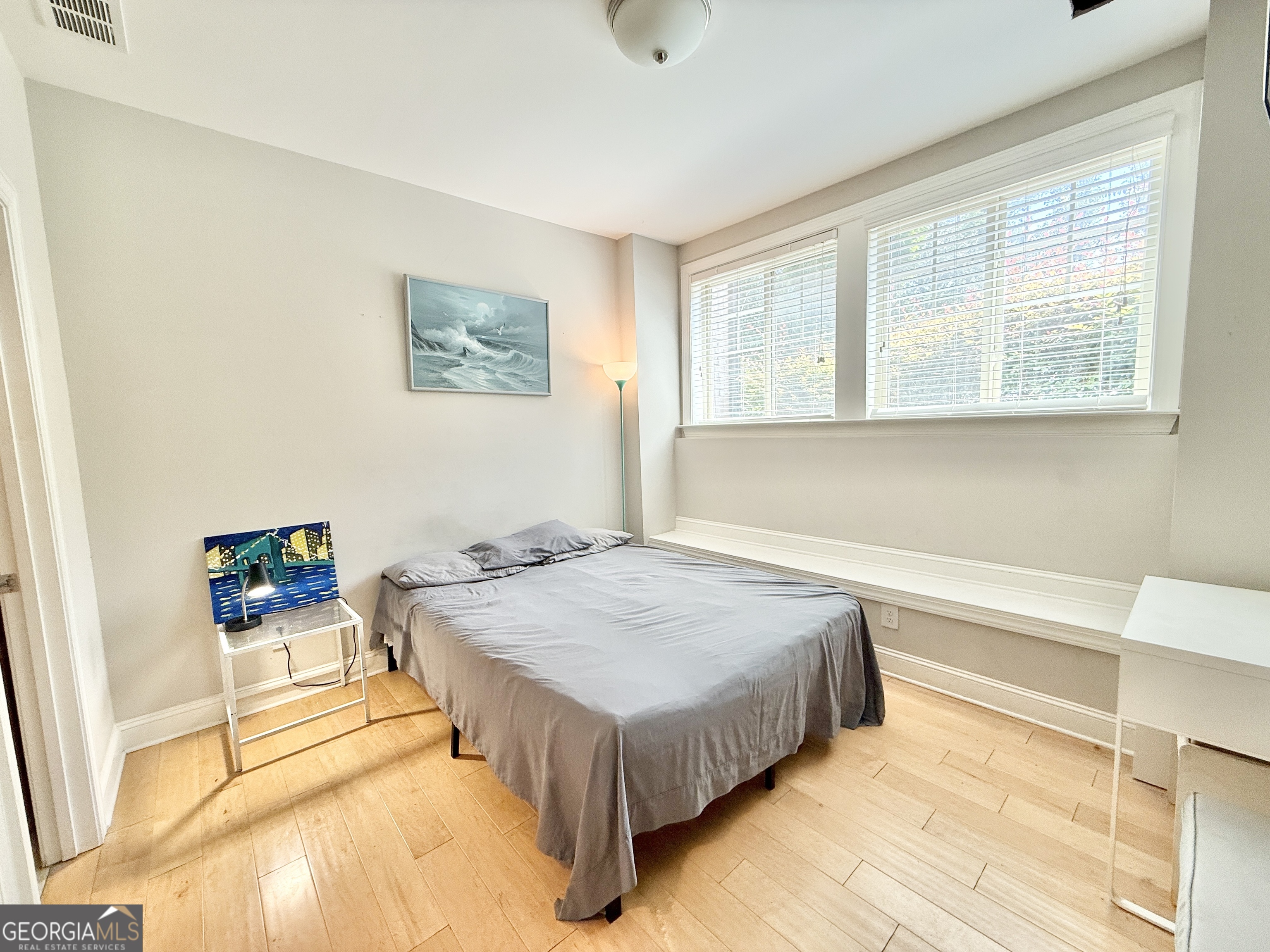 1817 Hislop Lane Atlanta, GA 30345 - Photo 22 of 32 a spacious bedroom with a bed and a window