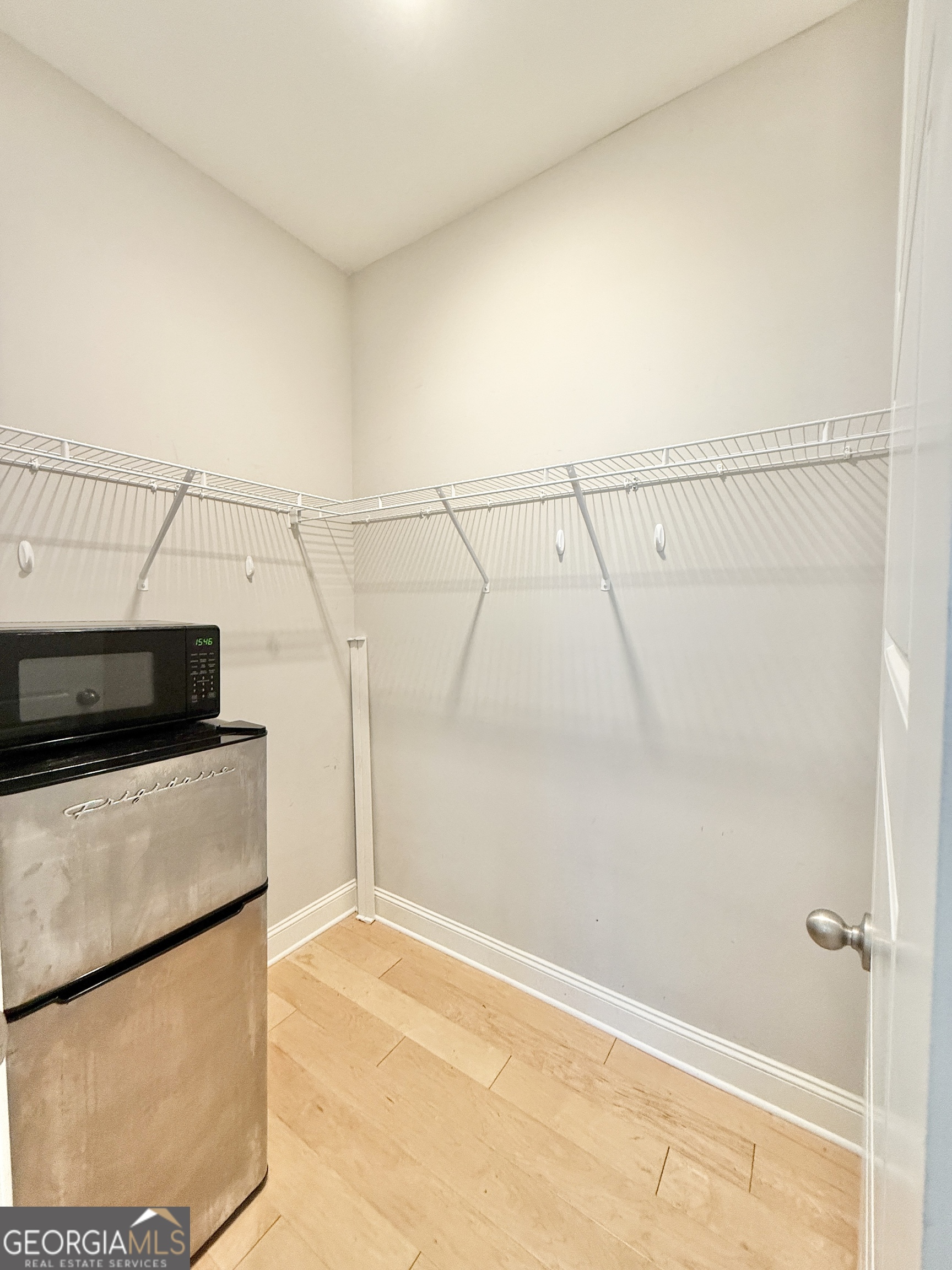 1817 Hislop Lane Atlanta, GA 30345 - Photo 23 of 32 a view of a utility room with racks on the wall